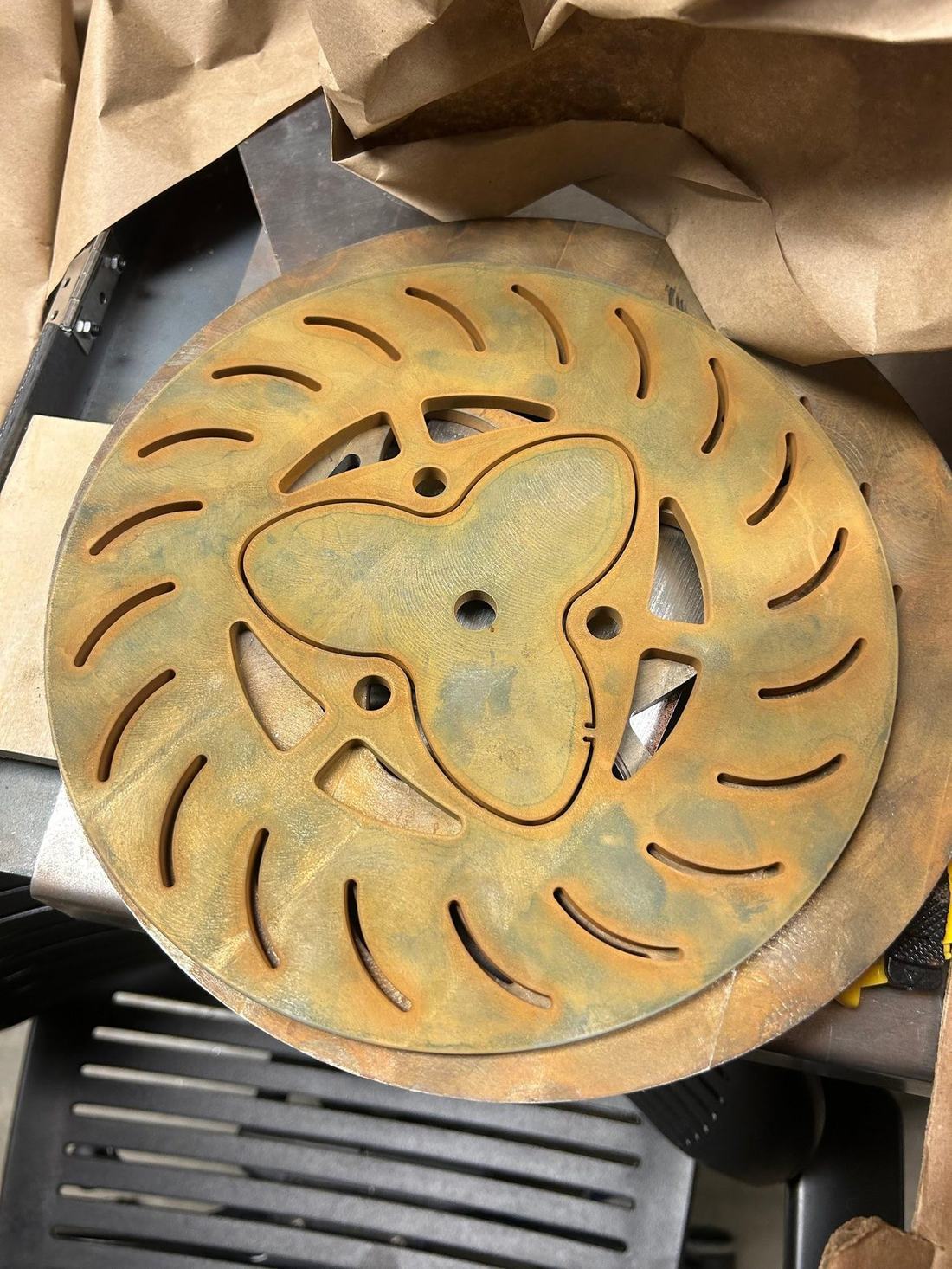 The original warped, corroded brake rotor